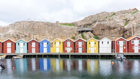 SmÃ¶gen, Sweden - June 9, 2021: A bay with colorful fishing cottages at Swedish west coastのeditorial素材