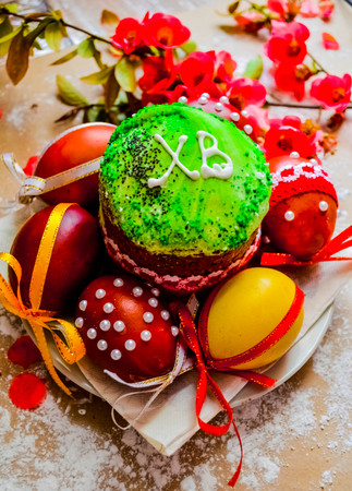 Easter bread and eggs with apple blossom. Orthodox Easter. The abbreviation means Christ is Risenの写真素材