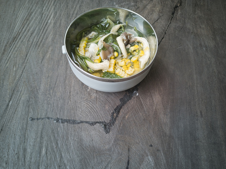 Vegetable Soup consists of mushroom, corn and spinach.の写真素材