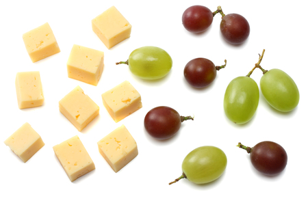 piece of cheese with grapes isolated on white backgroundの写真素材