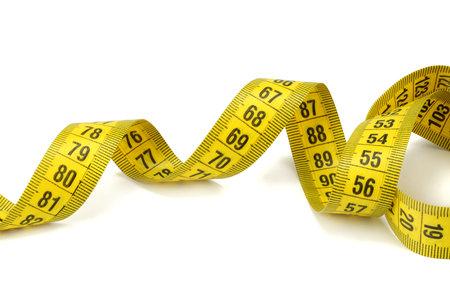Yellow measuring tape isolated on white background