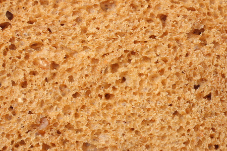 Whole grain bread texture background. macro. top viewの写真素材