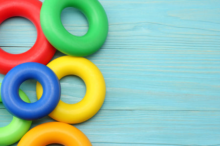 colorful plastic toys on blue wooden background. Top view.の写真素材