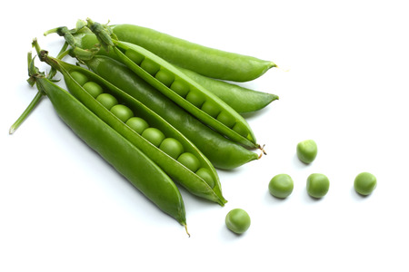 fresh green peas isolated on a white backgroundの写真素材