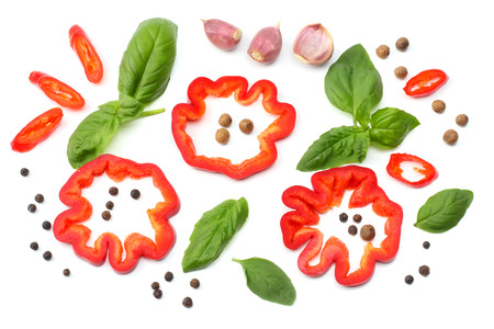 mix of slice of tomato, basil leaf, garlic, sweet bell pepper and spices isolated on white background. top viewの写真素材