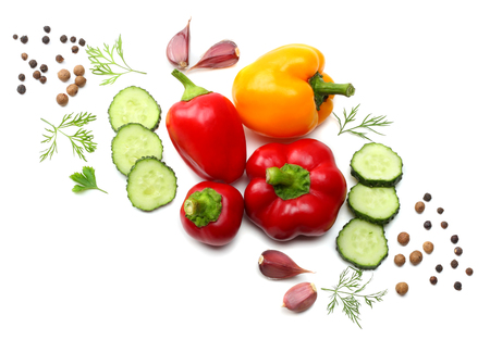 mix of sliced cucumber, garlic, sweet bell pepper and parsley isolated on white background. top viewの写真素材