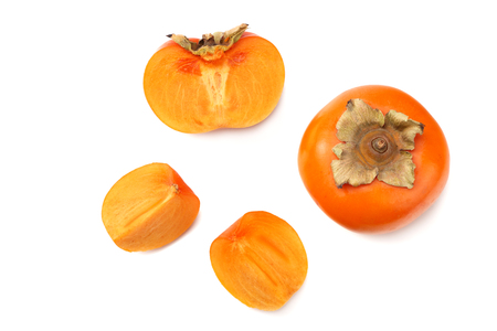 fresh ripe persimmons with slices isolated on white background. top viewの写真素材