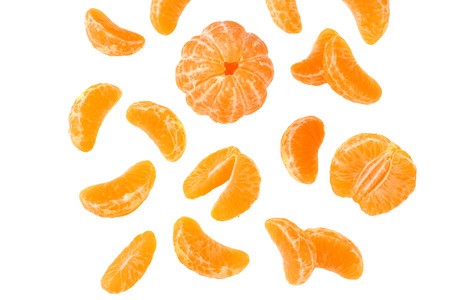 mandarin with flying slices isolated on white backgroundの写真素材