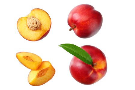 Nectarine with green leaf and slices isolated on white background. top viewの写真素材