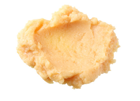 splash of chickpea hummus isolated on white background