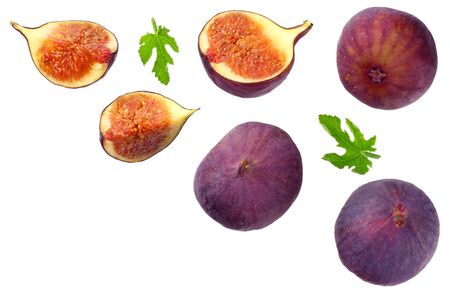 Fig fruit with green leaf and slices isolated on white background Top viewの写真素材
