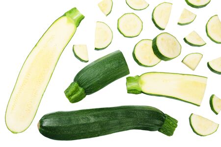 fresh green zucchini with slices isolated on white background. top viewの写真素材