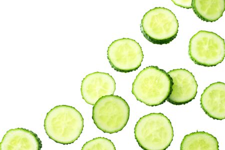 fresh cucumber slices isolated on white background. top viewの写真素材