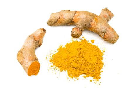 Turmeric powder with turmeric root isolated on white background. Top view.の写真素材