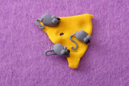 plasticine cheese with mice on pink background. modelling clayの写真素材