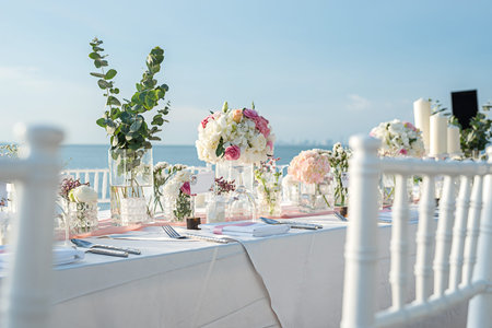 Wedding table Setup on the beach with sunset timeの写真素材