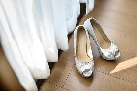 Bridal shoes on floorの写真素材