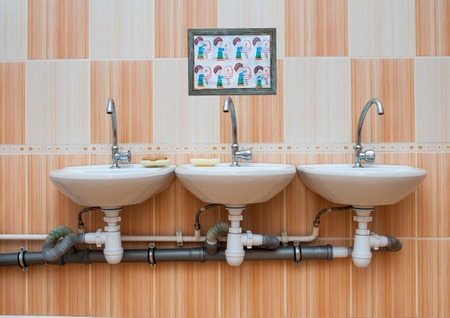 washbasins in the children's toiletの写真素材