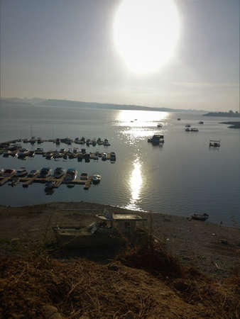 sun, water and boatsの写真素材