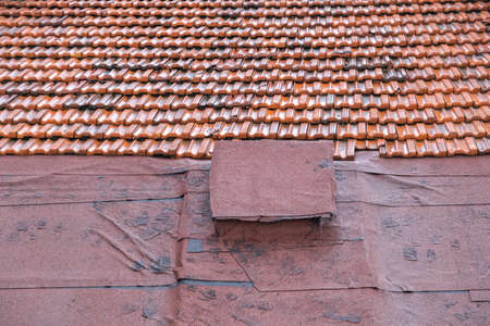 old roof covered with tiles, insulation,の写真素材