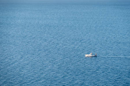 small fishing boat in the sea, tranquil,の写真素材