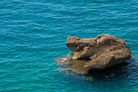 rock in the sea, stone, islandの写真素材