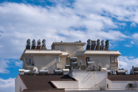 solar water heaters on the roofs of buildings. renewable energy for the home,の写真素材
