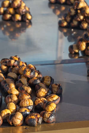 fried chestnut vendor, street food,の写真素材
