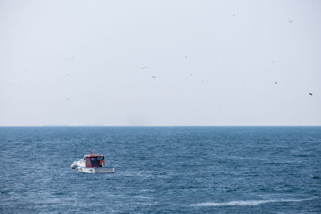 small fishing boat in the sea and fisherman,