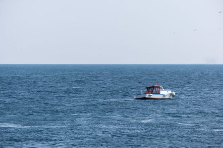 small fishing boat in the sea and fisherman,