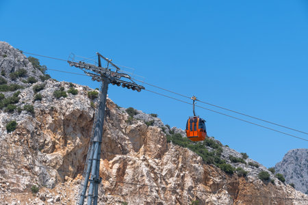 Ski lift. cable car poles. reels on pole. Aerial lift pylon.のeditorial素材