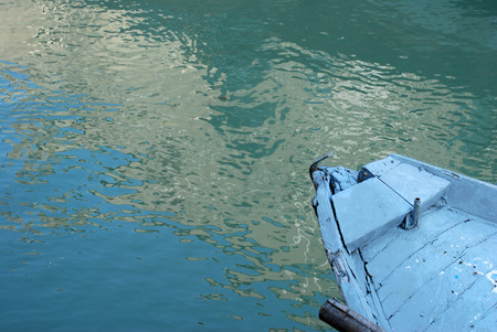 Old blue wooden fishing boat shabby detail.の写真素材