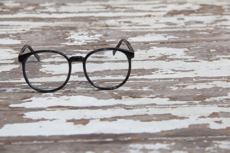 Black glasses on woodenの写真素材