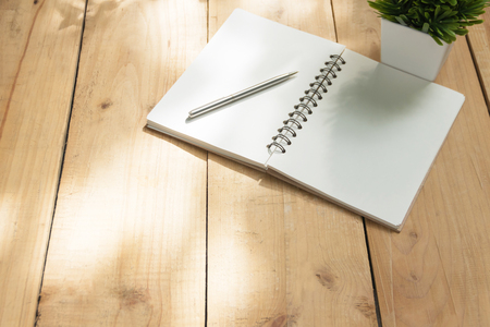 Blank Book on wooden of brown. top view with copy spaceの写真素材