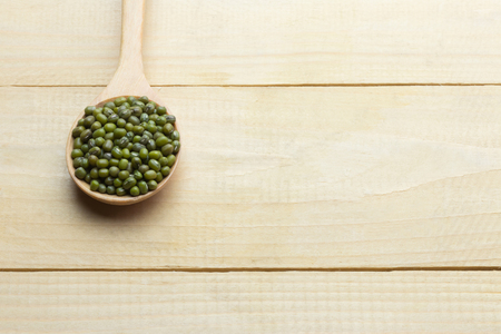 Mung dried bean on wood spooncopy space high angle backgroundの写真素材