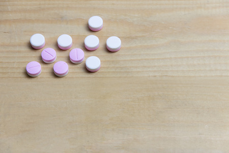 Drug on wooden table top view background copy spaceの写真素材