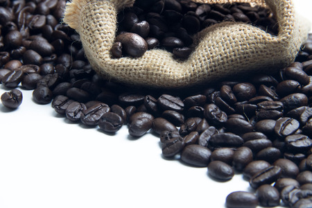 Fresh coffee bean in sack on white background isolated with copy spaceの写真素材