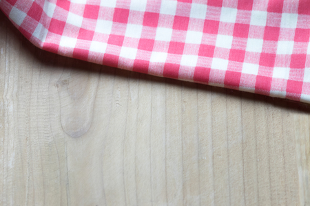 Top view plaid napkin on wooden table of brown. copy spaceの写真素材