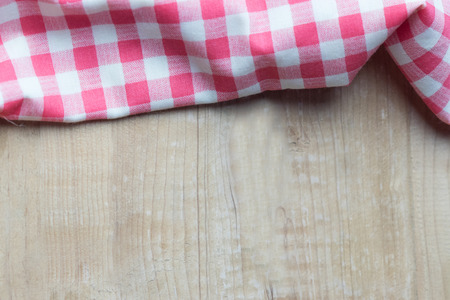 Red plaid on wooden table. high angle viewの写真素材