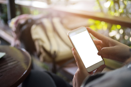 Mock up hand hold mobile phone empty screen, business technology conceptの写真素材