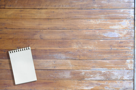 Empty small book on wooden table of brown, copy space, for presentation productの写真素材