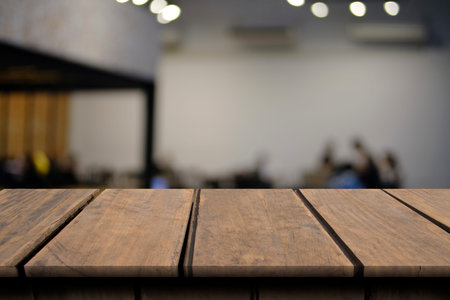 Blank wooden table of brown on front in blurred restaurant background