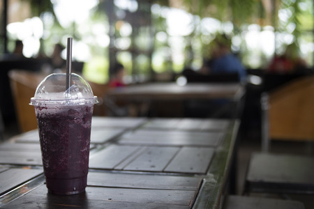 Grape juice on table blurred backgroundの写真素材