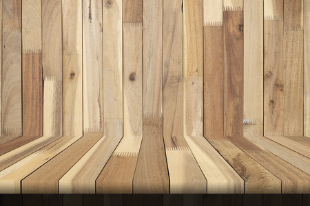 Laptop and note pad and hot coffee on wooden table of brown, copy space, for uesd business templateの写真素材