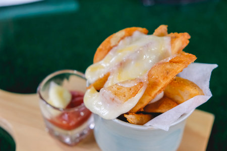 French fries with sheet on top, on wooden