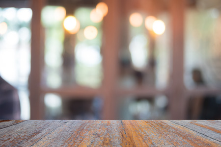 Old wooden table on front with blurred background, used for presentation product and templateの写真素材