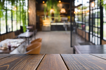 Wooden table of brown on front blurred colorful background, presentation and templateの写真素材