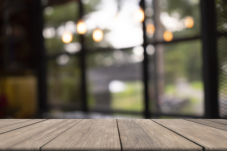 Wooden table on front blurred backgroundの写真素材