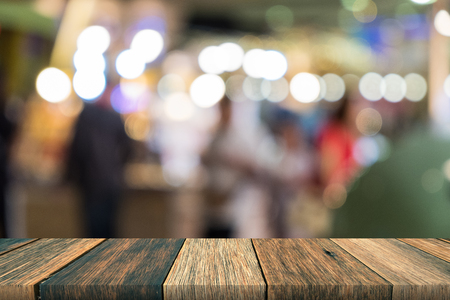 Emtpy wooden desk on front blurred background, use for presenetation product and mock up for templateの写真素材