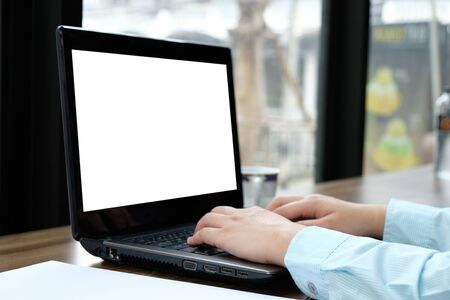 Woman used computer laptop on wooden table bar, example text on screen, business technology concept, mock up on screen laptop, clip paths at screenの写真素材
